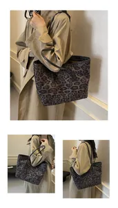Three-way view of a large leopard print tote bag with black straps on a trench coat model