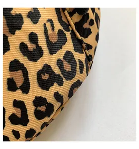 Detailed macro view of high-quality leopard print nylon fabric with twill texture