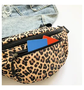 Macro detail of leopard print nylon chest bag with zip pockets and storage capacity