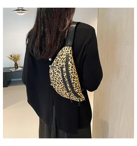 Close-up of leopard print nylon chest bag with double zippers worn by a model