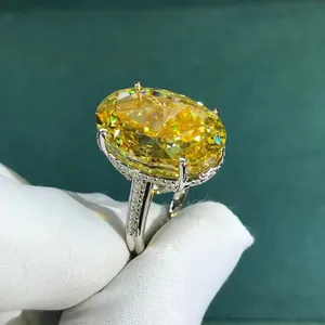 Macro detail of a 30ct oval yellow gemstone ring with micro-pave setting on silver band