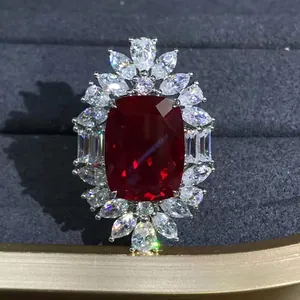 Luxury silver flower ring featuring a 10-carat cushion-cut red ruby on jewelry box