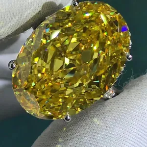 Macro shot of a 30ct oval-cut yellow sparkling gemstone ring with four-prong setting