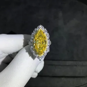 Sparkling 10ct marquise-cut yellow high carbon diamond ring with cluster halo design