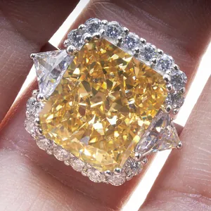 Luxurious radiant cut yellow carbon diamond ring with side stones in 10-carat style