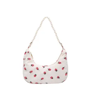 Corduroy crescent underarm bag with strawberry print and pearl beaded strap