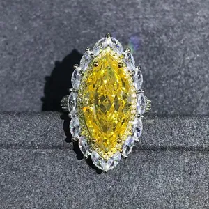 Luxurious marquise cut yellow gemstone ring with 3EX VVS sparkle and halo setting