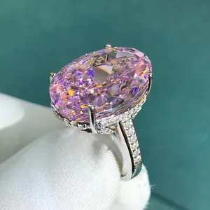Luxury oval cut pink gemstone ring with micro-paved diamonds in silver setting