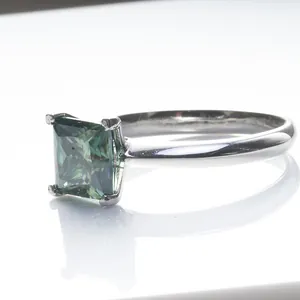 925 sterling silver ring with princess cut teal moissanite in four-prong setting