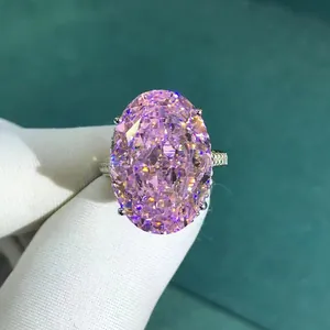 30 carat oval cut pink diamond ring with sparkling side stones and silver band