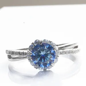 925 silver halo ring featuring round blue moissanite and crossover pavé band detail