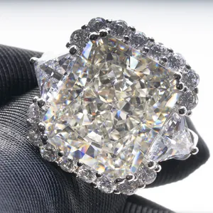 Luxurious radiant cut pink diamond ring with halo setting and triangular side stones
