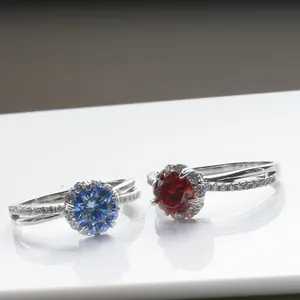 Elegant 925 silver rings featuring blue and red round moissanite with crossed bands