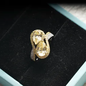 Pear cut yellow carbon diamond ring in S925 sterling silver with a dual stone wave design