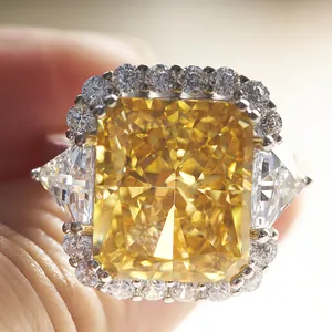 Luxury 10ct yellow radiant cut diamond ring with trillion side stones in silver setting