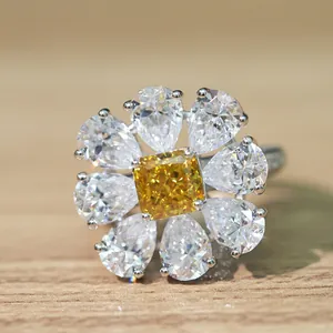 Macro shot of Radiant cut yellow high carbon diamond ring with silver floral setting