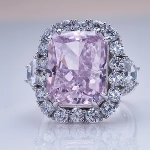 Macro view of 10ct radiant cut pink diamond ring with halo setting and silver band