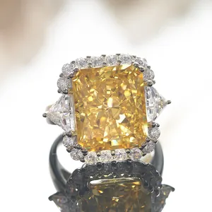 10 carat radiant cut yellow diamond ring in silver with triangle side stones and halo
