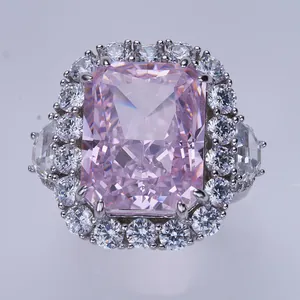 Macro view of 10ct radiant cut pink carbon diamond ring with halo and side stones