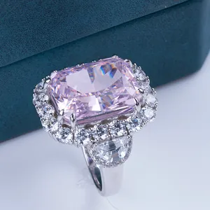 Macro detail of radiant cut pink carbon diamond ring with silver pave setting