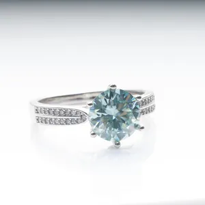 Elegant six-prong blue moissanite sterling silver ring with double pavé diamond band
