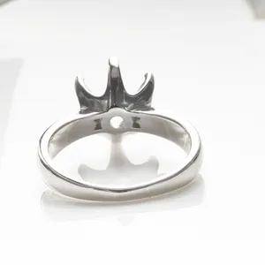 Polished silver moissanite ring setting featuring a classic queen crown prong mount