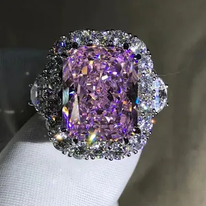 Macro shot of a 10-carat radiant-cut pink gemstone ring with a diamond halo detail