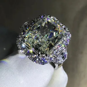 Macro shot of a 10ct radiant cut yellow carbon diamond ring with halo and side pear stones