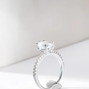 Macro detail of 4-prong set 2ct oval moissanite ring with S925 sterling silver band