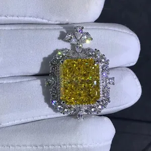 Radiant cut 15ct yellow diamond pendant with clover bail and silver pavé halo
