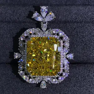 Close-up of a 15-carat radiant cut yellow diamond pendant set in polished silver metal