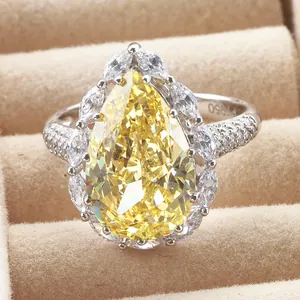 6ct Pear Cut Yellow Carbon Diamond Ring with PT950 Hallmark on Beige Jewelry Box