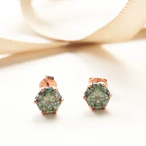 Macro shot of S925 sterling silver stamp on rose gold green moissanite stud earrings