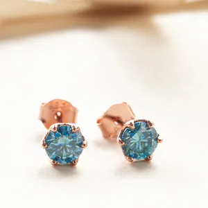 Detail of blue Moissanite stud earring in rose gold with S925 hallmark engraving