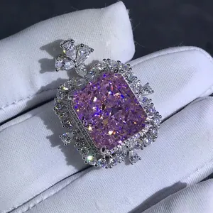 Exquisite radiant cut purple-pink diamond pendant with intricate halo on silver base