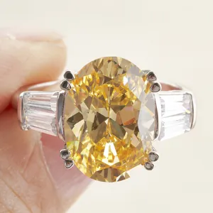Luxury 6ct oval yellow high carbon diamond ring with tapered side stones in sterling silver