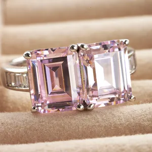 Luxurious 6-carat emerald cut pink diamond ring with twin stones in silver plating