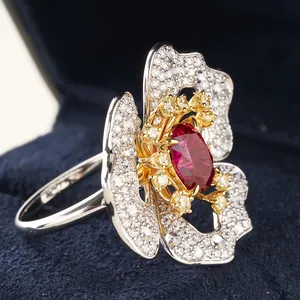 Oval red ruby floral ring in S925 silver with white diamonds on a velvet box