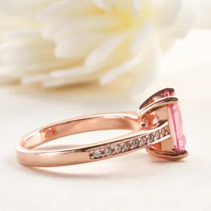 Elegant 2-carat pink emerald cut gemstone ring in rose gold finish with micro-pavé stones