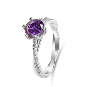 Macro detail of 925 sterling silver ring showing purple gemstone and twisted band