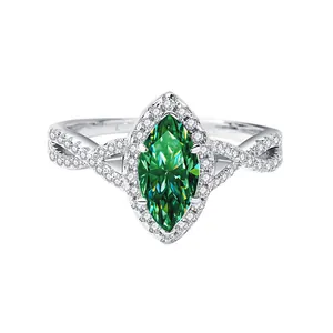 Anillo de moissanita verde corte marquesa en plata 925 con banda trenzada de diamantes