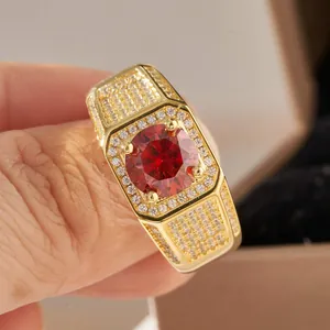 Luxury gold plated men's ring with a large red stone and shimmering white zircon accents