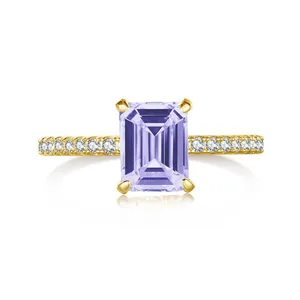 Close-up of emerald cut pink moissanite ring in gold plated S925 silver setting
