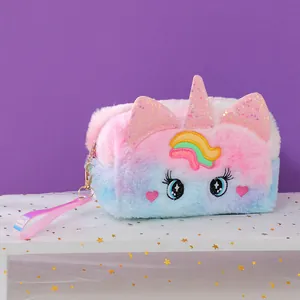 Close-up of rainbow plush unicorn pouch with sequin horn and embroidered big eyes