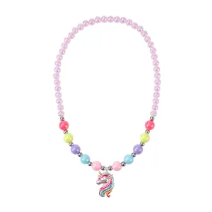 Detail of colorful beads and rainbow unicorn pendant on a children's beaded necklace