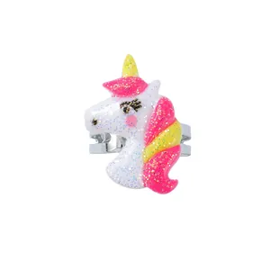 Close-up of glitter unicorn ring for kids with adjustable silver metal band
