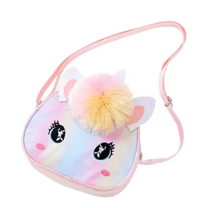 Detail of sequin glitter finish and colorful pom-poms on the unicorn crossbody bag