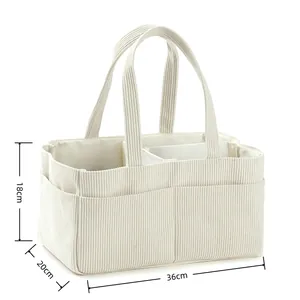 Detailed size view of a large corduroy diaper bag with internal dividers for storage