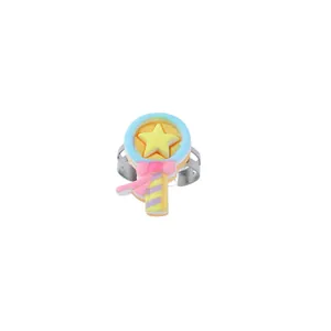 Detail showing a colorful cartoon magic wand design on an adjustable metal ring for kids