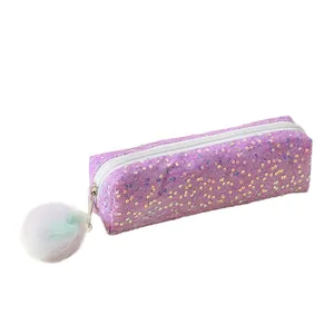 Sparkly purple sequin pencil case with colorful pompom keychain and white zipper